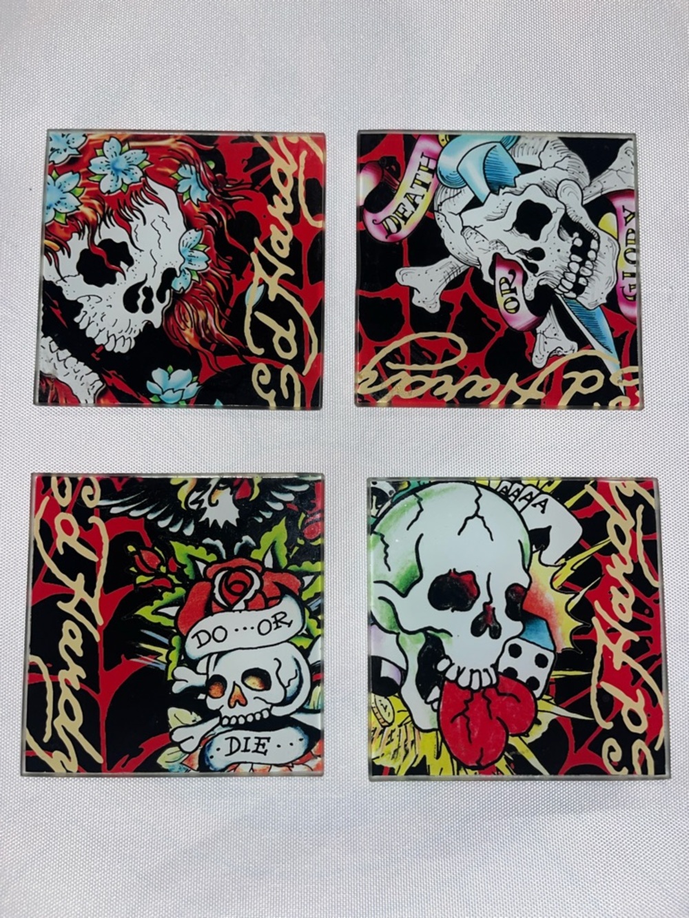 ED HARDY 4 piece glass coaster set with holder